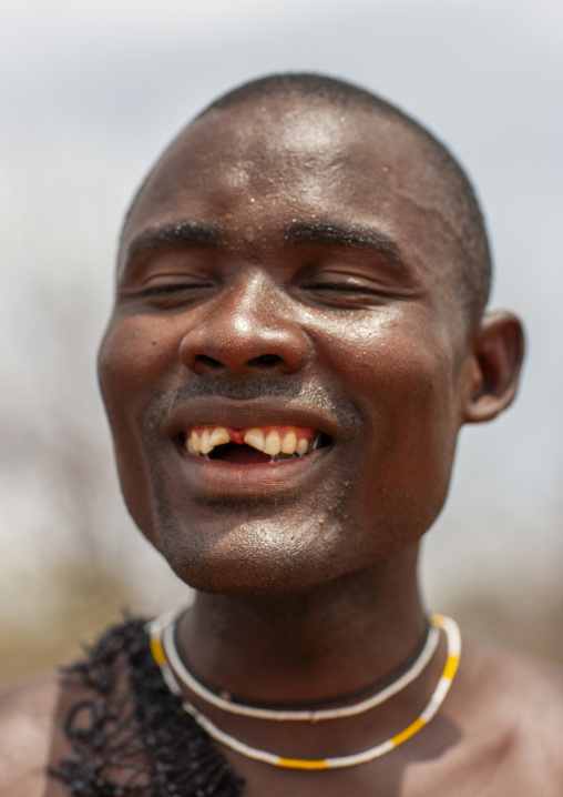 Mucubal man with removed teeth, Namibe Province, Virei, Angola