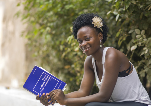 Female student with a book of political science, Benguela Province, Benguela, Angola