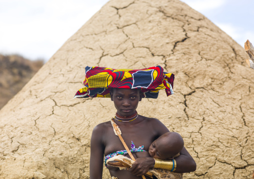 Mucubal tribe woman holding her baby, Namibe Province, Virei, Angola
