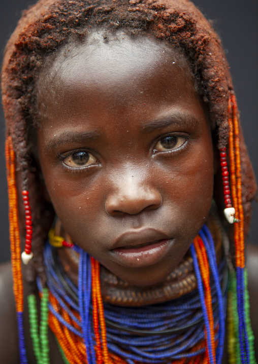 Shy Mwila girl with beaded ornaments, Huila Province, Chibia, Angola