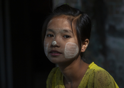 Girl with thanaka on cheeks, Rakhine state, Ngapali, Myanmar