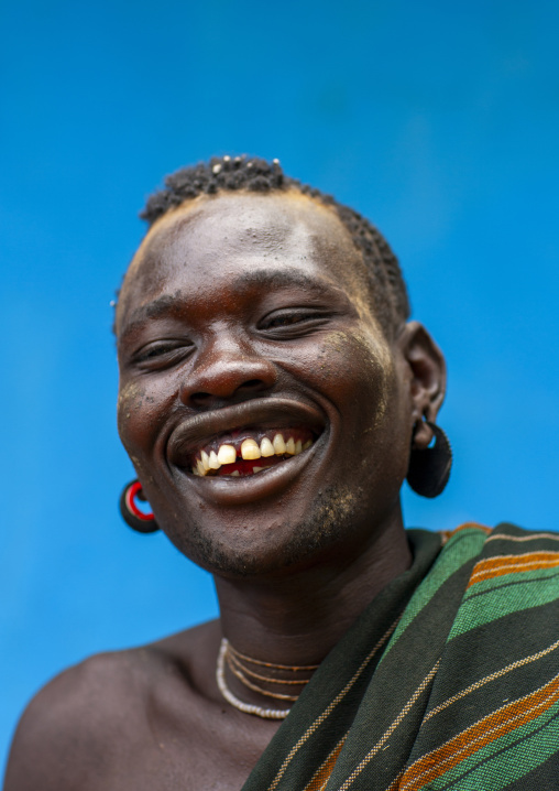Laughing Bodi tribe man portrait, Omo Valley, Hana Mursi, Ethiopia