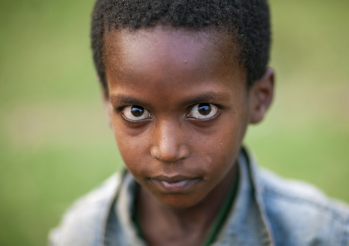 Portrait of a boy with big eyes, Benje region, Benje, Ethiopia