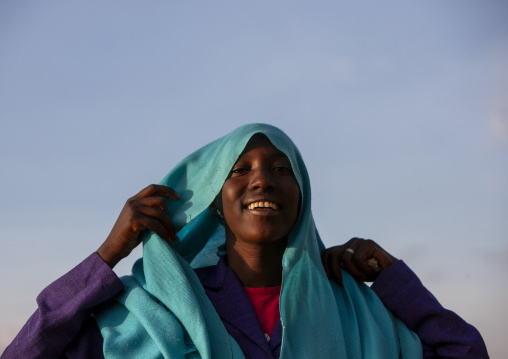 Oromo woman putting back her headscarf, Dire Dawa woreda, Dire Dawa, Ethiopia