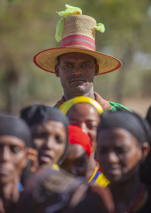 Tall muslim man wearing big hat and standing over the crowd, Kembata, Alaba, Ethiopia