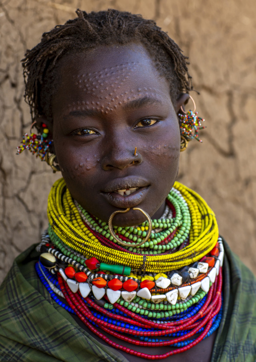 Portrait of a topossa woman, with traditional clothes, Omo valley, Kangate, Ethiopia