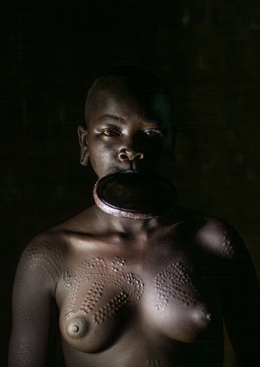 Surma woman wearing a lip plate, Turgit, Omo valley, Ethiopia