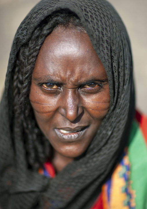 Portrait of a Karrayyu woman with scarifications on her face, Oromia, Metahara, Ethiopia