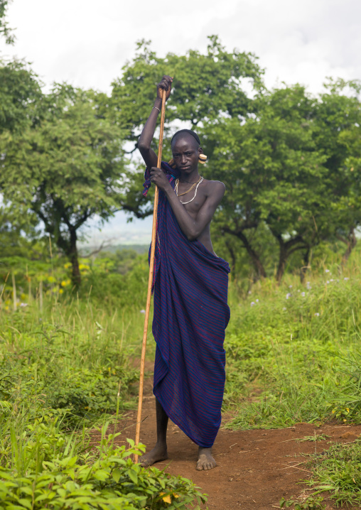 Surma man with a stick, Omo valley, Kibish, Ethiopia