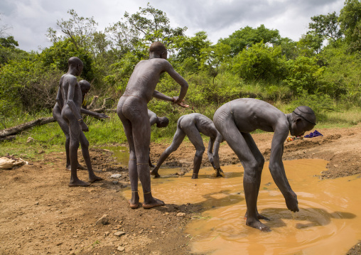 Men preparing for donga, Tulgit, Omo valley, Ethiopia