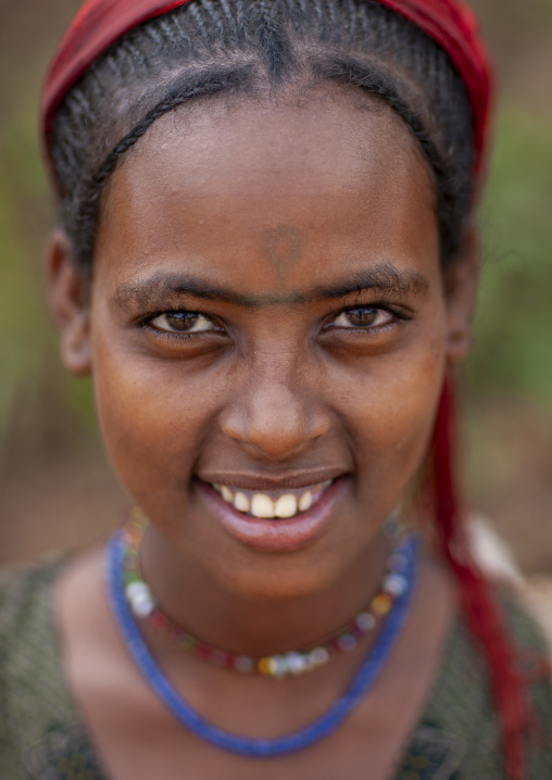 Portrait of a Wollo woman with big eyebrows, South West Region, Mizan Teferi, Ethiopia