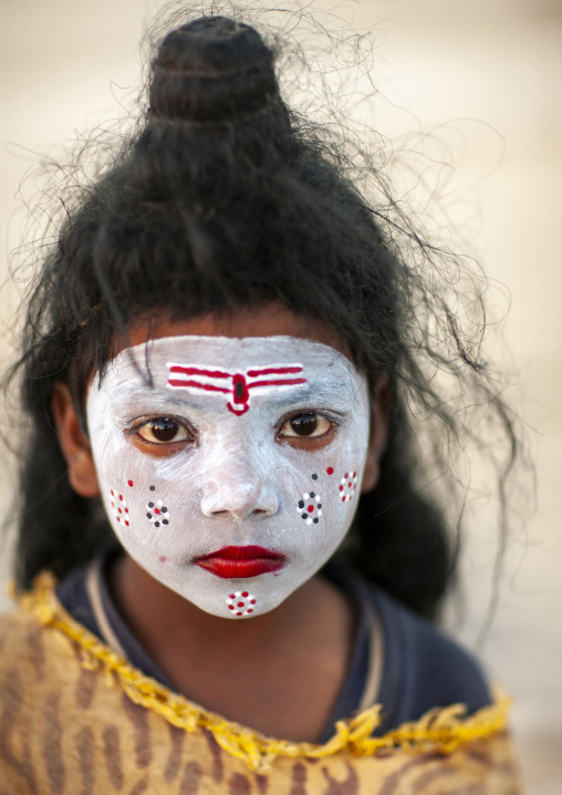 Young girl with shiva make up during Maha kumbh mela, Uttar Pradesh, Allahabad, India