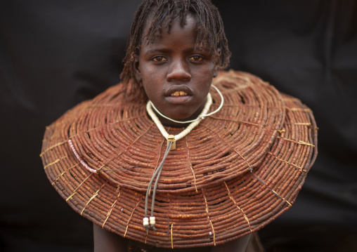 Pokot girl wears necklaces made from the stems of sedge grass, Baringo county, Baringo, Kenya