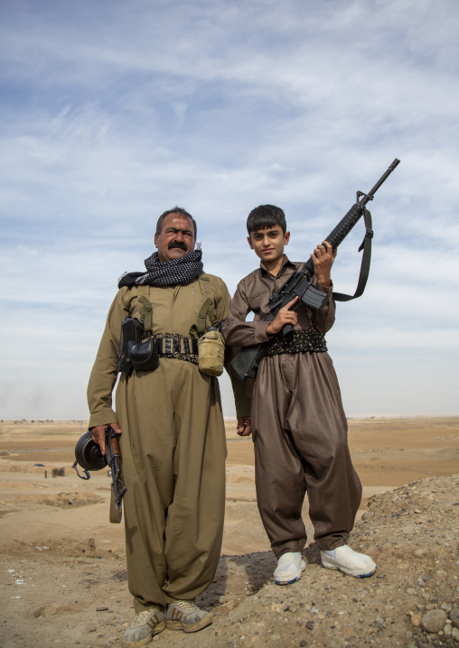 Kurdish general and his son on the frontline, Kirkuk, Kurdistan, Iraq