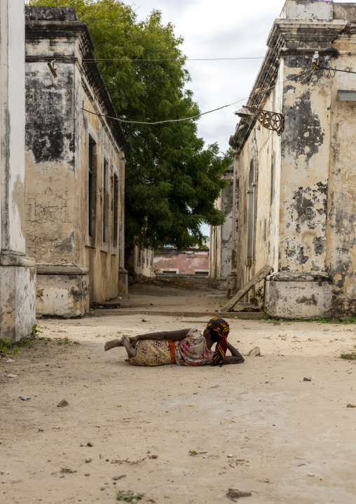 Woman lying in the old hospital, Ilha de mocambique, Nampula province, Mozambique