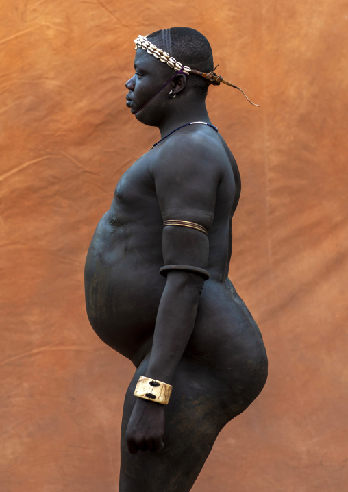 Bodi tribe fat man during kael ceremony, Hana Mursi, Omo valley, Ethiopia