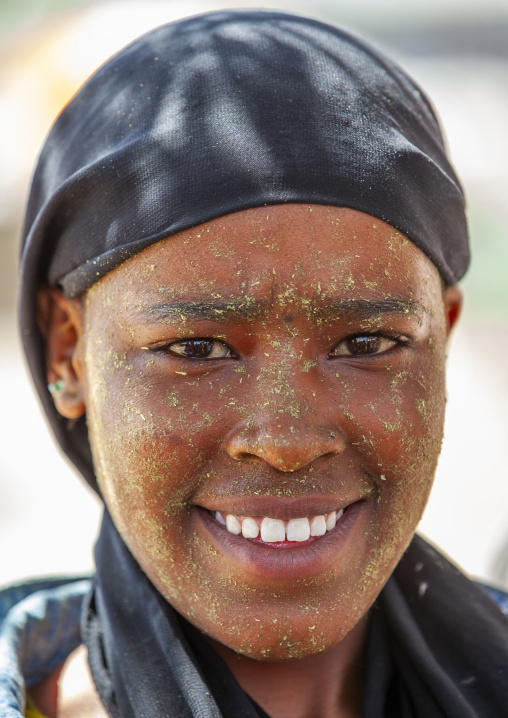 Smiling young woman with quasil on her face, Maroodi Jeh region, Hargeisa, Somaliland