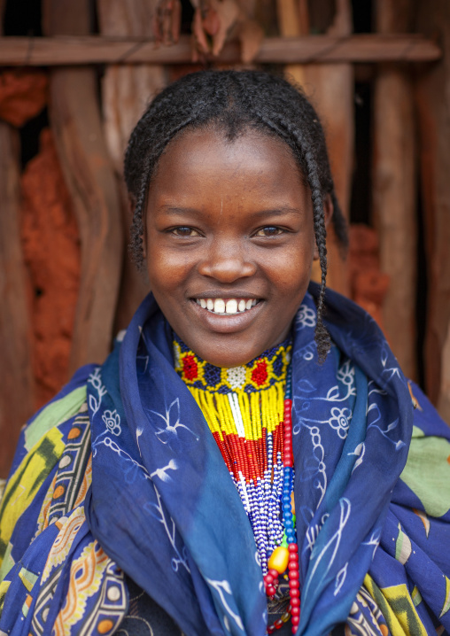 Portrait of a borana tribe girl with toothy smile, Yabello, Omo valley, Ethiopia