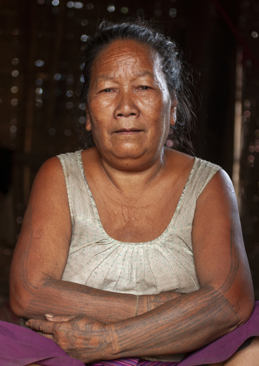 Khmu minority woman with tattoed arms, Xiangkhouang province, Xieng Khouang, Laos