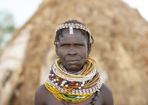 Nyangatom senior tribe woman with necklaces, Omo valley, Murile, Ethiopia
