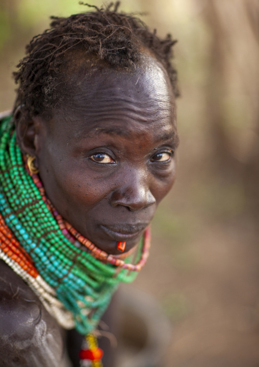 Nyangatom senior tribe woman with necklaces, Omo valley, Murile, Ethiopia