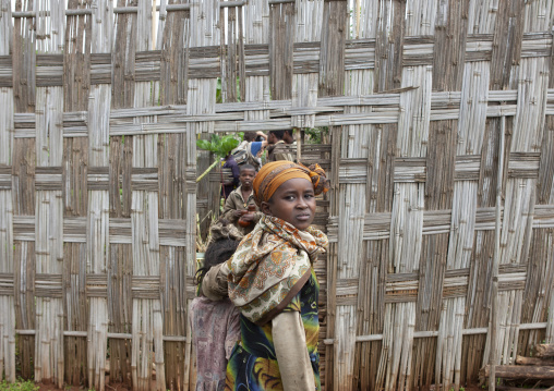 Dorze tribe children coming out of a bamboo fence, Chencha, Omo valley, Ethiopia