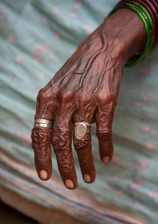 Old woman hand wearing rings, Tamil Nadu, Mahabalipuram, India