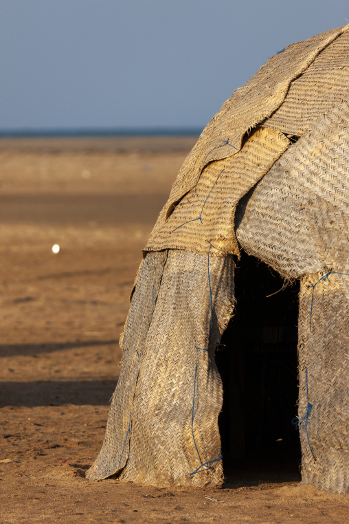 Woven mats form the walls of a traditional hut entrance, Obock Region, Gorodia, Djibouti