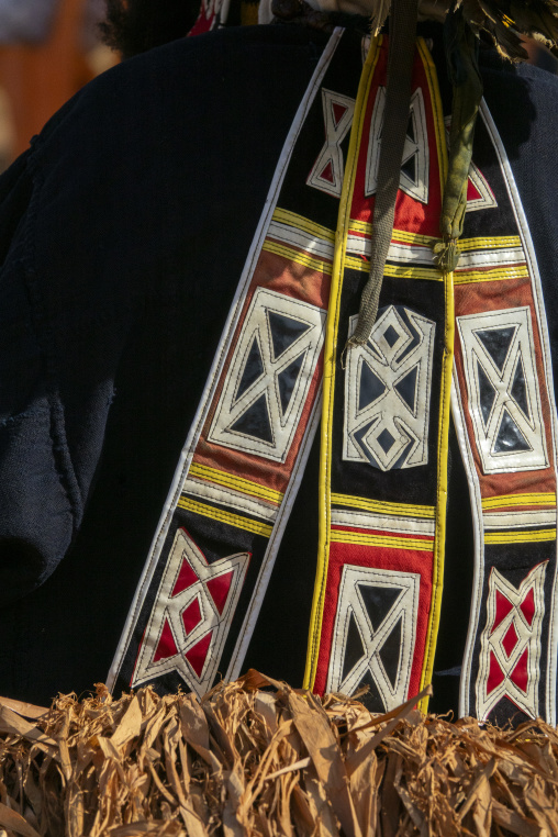 Geometric appliqué patterns decorate fabric bands on a Dan tribe ceremonial costume, Bafing, Gboni, Ivory Coast