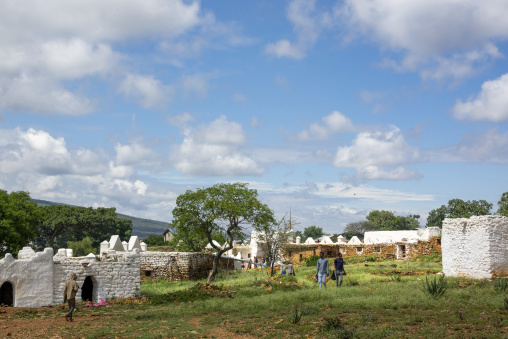 Whitewashed shrine buildings and tombs spread across a rural pilgrimage complex, Oromia, Sheik Hussein, Ethiopia