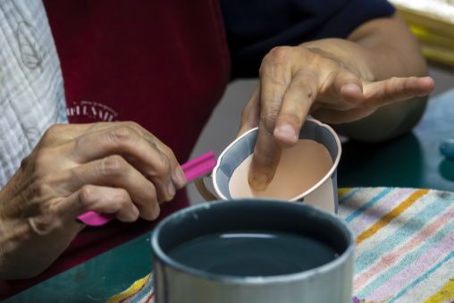 Artisan in Genemongama porcelain atelier, Kyushu region, Arita, Japan