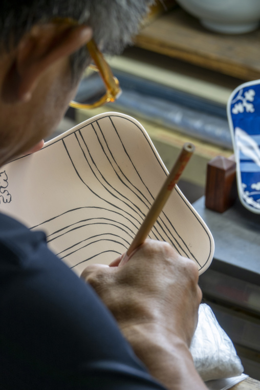Artisan in Genemongama porcelain atelier, Kyushu region, Arita, Japan