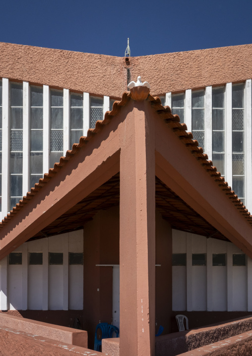 Terracotta tiled gable of the old Portuguese exhibition building topped with a dove ornament, Huila Province, Lubango, Angola