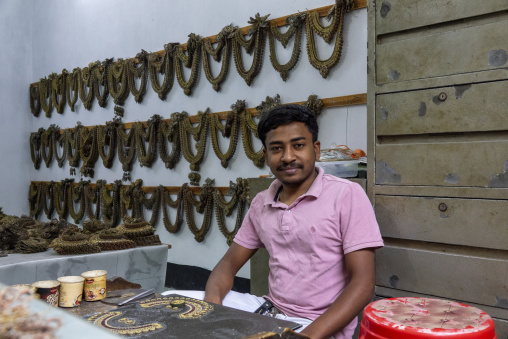 Metal worker using old lost wax casting method to create jewels, Dhaka Division, Dhamrai, Bangladesh