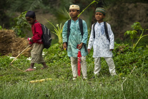 Muslim schoolboys walking home from madrasa, Khulna Division, Na