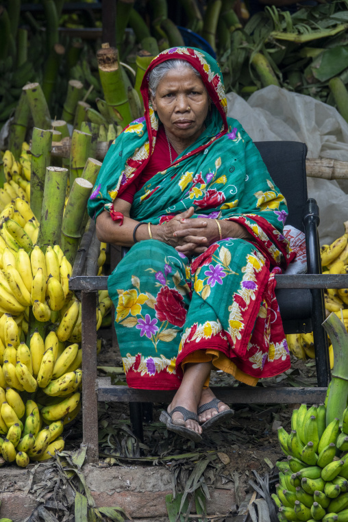 Portrait of a woman selling bananas at a wholesale market, Dhaka