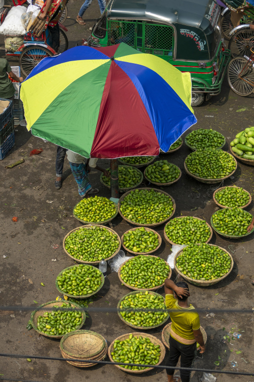 Aerial view of baskets filled with hog plums at a street market,