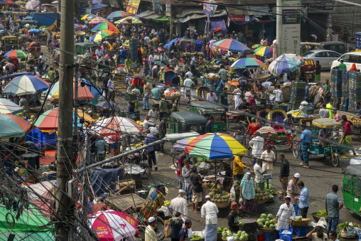 Aerial view of a crowded fruit and vegetable market street with