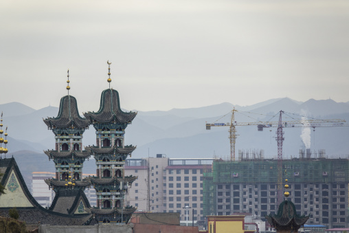 Twin pagoda-style minarets blend Chinese and Muslim architecture at a mosque, Gansu Province, Hezuo, China