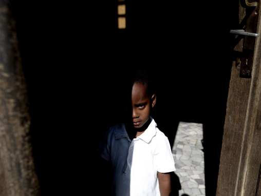 Eritrean boy in a door, Central Region, Asmara, Eritrea