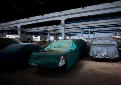 Cars under wraps old FIAT garage now used as a parking, Central region, Asmara, Eritrea
