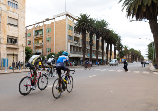 Eritrean cyclists on harnet avenue, Central region, Asmara, Eritrea