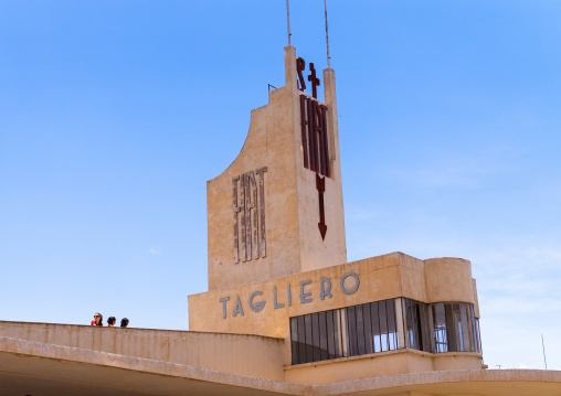 Tourists on FIAT tagliero service station built in 1938, Central region, Asmara, Eritrea