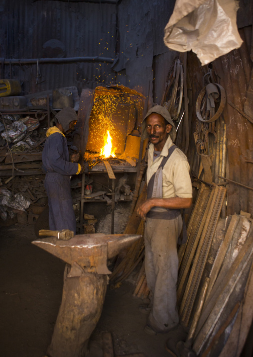 Blacksmith at medebar metal market, Central Region, Asmara, Eritrea