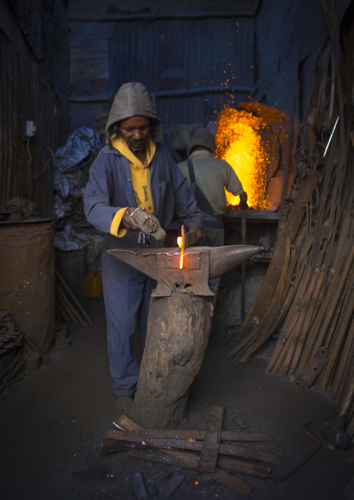 Blacksmith at medebar metal market, Central Region, Asmara, Eritrea