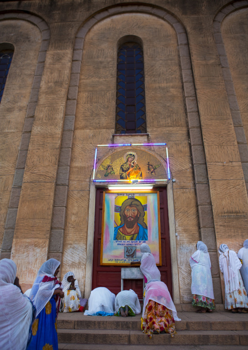 Eritrean women praying in front of a church, Central Region, Asmara, Eritrea