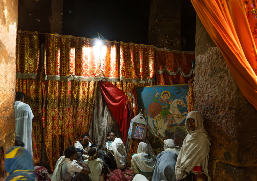 Pilgrims in a rock-hewn church, Amhara Region, Lalibela, Ethiopia