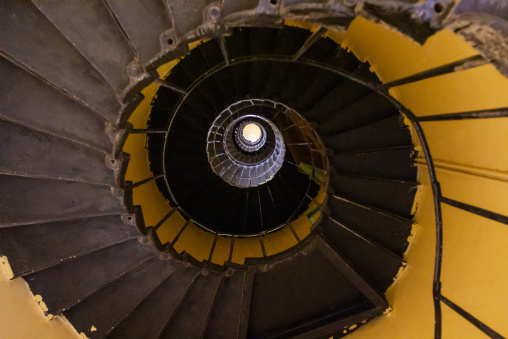 A spiral staircase winds downward inside the Sanganeb reef lighthouse, Red Sea State, Sanganeb, Sudan