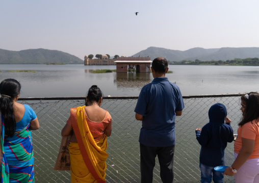 Indian tourists in front of Jal mahal water palace on Man Sagar lake, Rajasthan, Jaipur, India