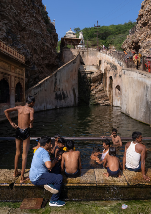 Indian pilgrims having a bath in Galtaji temple aka monkey temple, Rajasthan, Jaipur, India